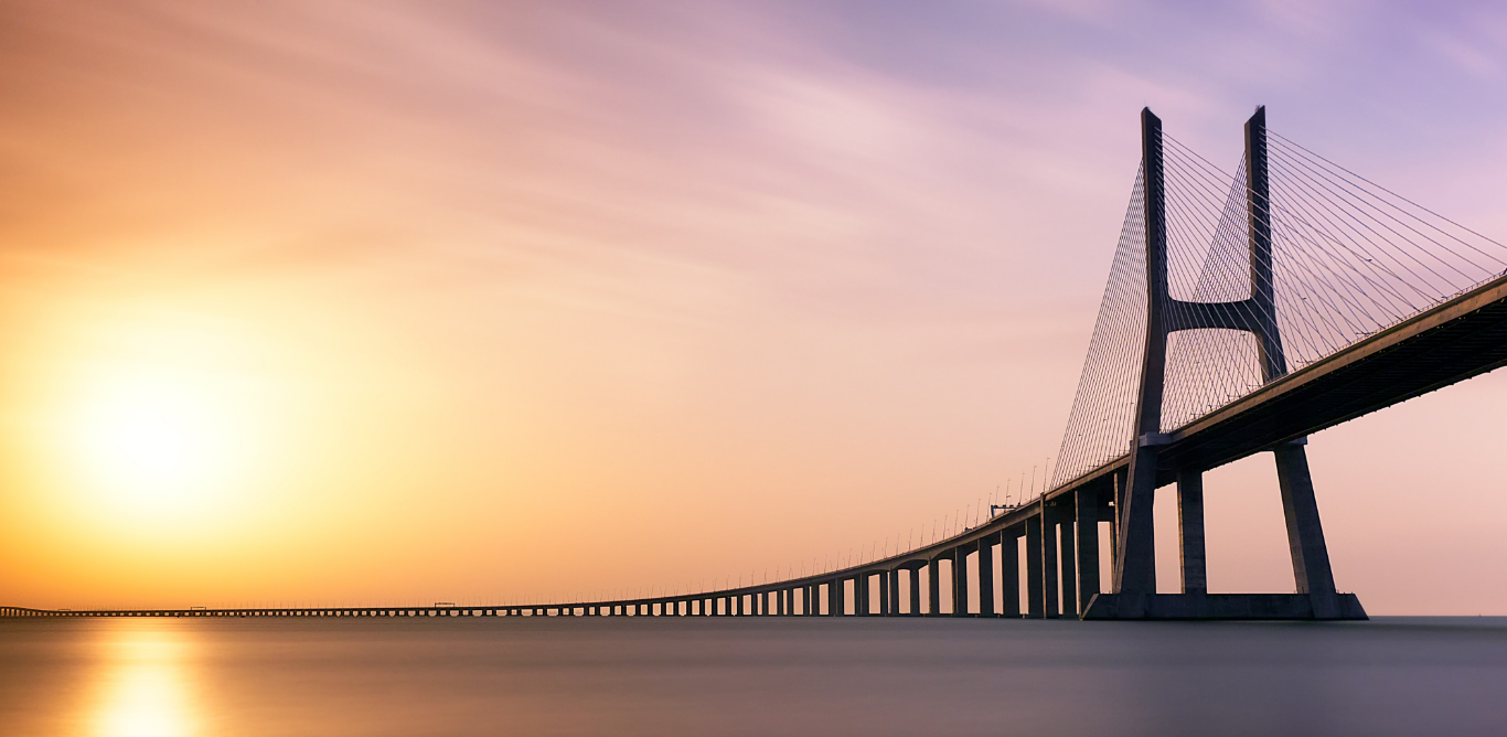 Bridge across the water at dawn